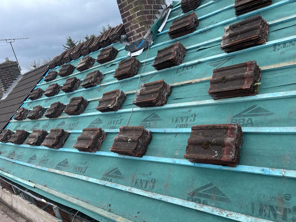 Professional roof tiling with clay tiles on battens - Leeds roofing services