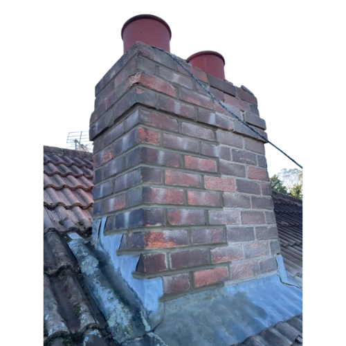 Brick chimney stack with red clay pots and new lead flashing on Leeds roof