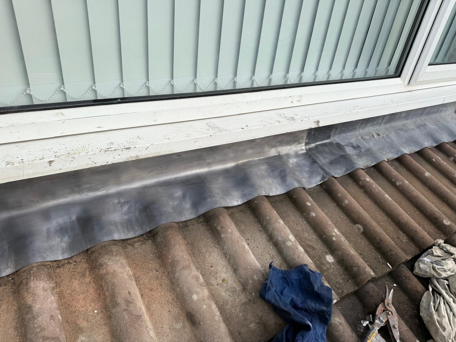 New lead flashing installed at window junction on tiled roof in Leeds by JLR Smith Roofing