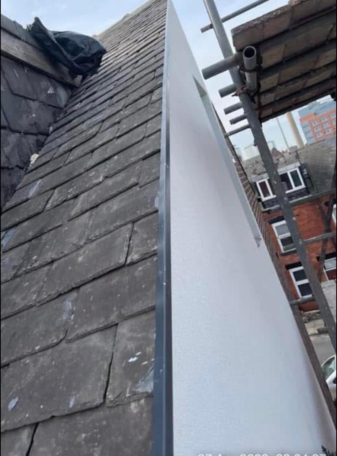 New white uPVC fascia board installed alongside slate roof in Leeds by JLR Smith Roofing