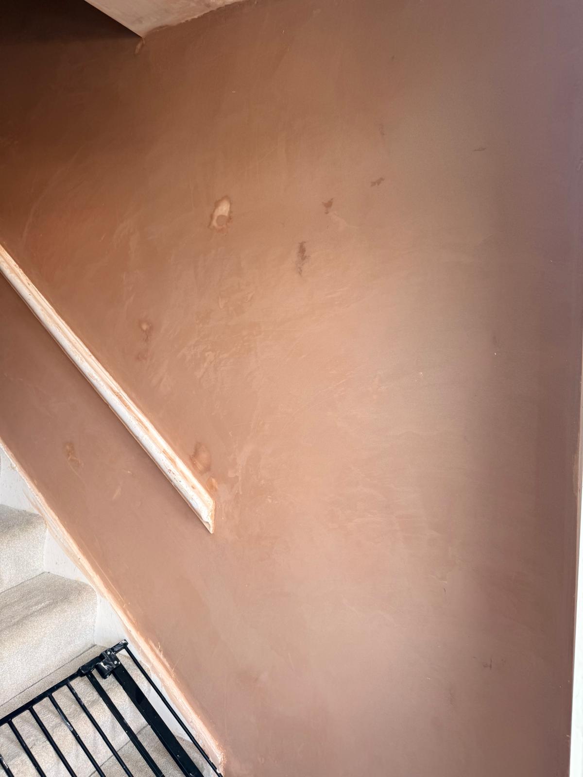 Freshly plastered staircase wall in Leeds by JLR Smith Roofing and Plastering