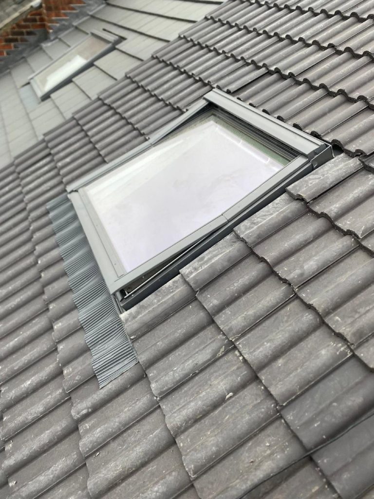 Roofer's perspective showing the ridge running away with a Leeds terraced row in the background.
